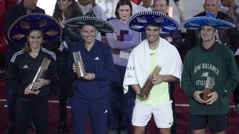 The quartet got in a festive spirit for the trophy presentation.